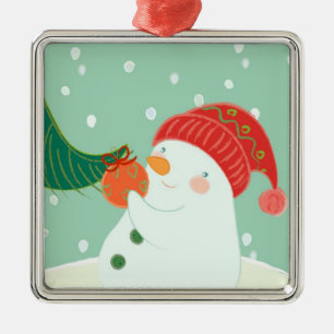A snowman hanging an ornament on a tree