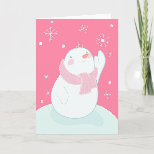A snowman reaching for a falling snowflake holiday card (Front)