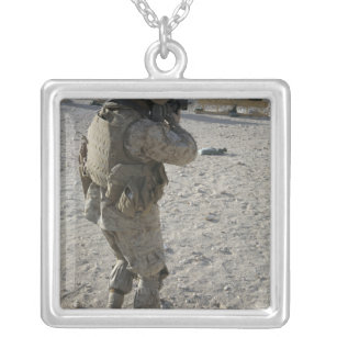 A soldier engages his target on a shooting rang silver plated necklace