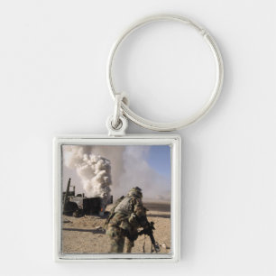 A Soldier reacts to a controlled explos Key Ring