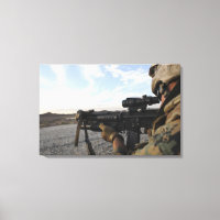 A soldier sights in to fire on a target