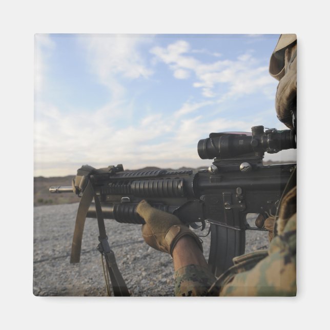 A soldier sights in to fire on a target magnet (Front)