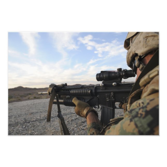 A soldier sights in to fire on a target photo print (Front)