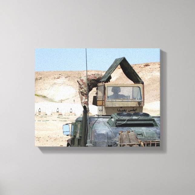 A soldiier instructs an Iraqi army soldier Canvas Print (Front)