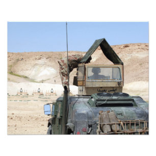 A soldiier instructs an Iraqi army soldier Photo Print