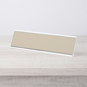 A solid brown background with a smooth, uniform te desk name plate