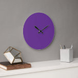 A solid purple background with a white square cent large clock<br><div class="desc">This meticulously designed print features a striking solid purple background with a clean white square positioned in the centre,  delivering a bold and sophisticated visual impact. The simplicity of the design makes it a versatile piece that can effortlessly enhance any space with its modern aesthetic.</div>