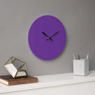 A solid purple background with a white square cent large clock