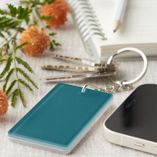 A solid teal colour fills the pattern key ring