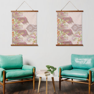 A sophisticated floral arrangement with ornate det hanging tapestry