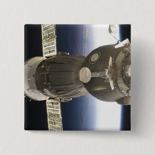 A Soyuz spacecraft backdropped by Earth 15 Cm Square Badge