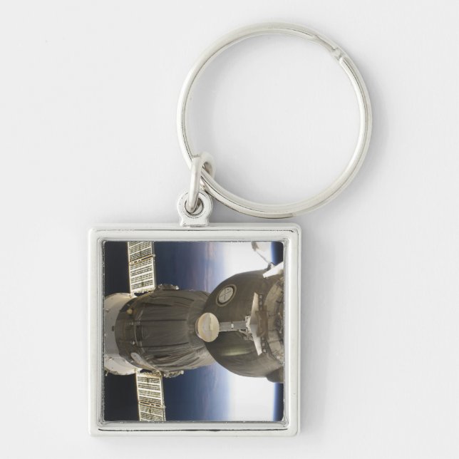 A Soyuz spacecraft backdropped by Earth Key Ring (Front)
