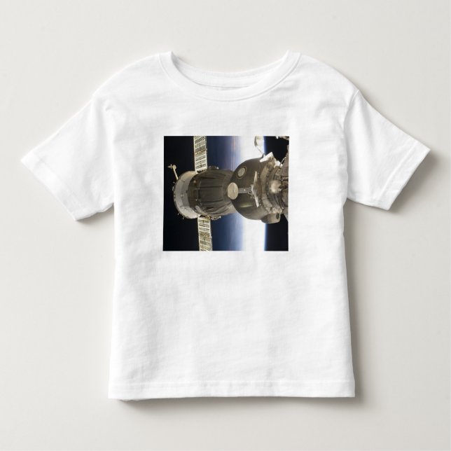 A Soyuz spacecraft backdropped by Earth Toddler T-Shirt (Front)