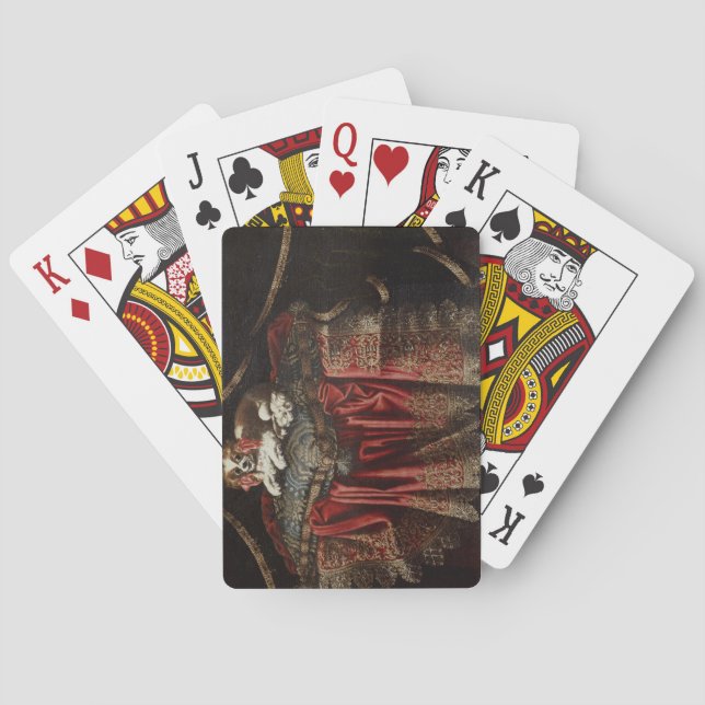 A spaniel seated on an embroidered cushion playing cards (Back)