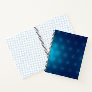A spiral-bound notebook with a blue cover