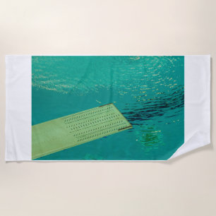 a springboard to dive into the pool beach towel