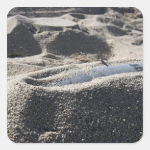 A static display of an ordnance shell square sticker