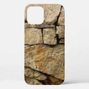 A stone wall made of cobblestones background textu iPhone 12 case