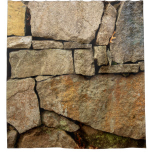A stone wall made of cobblestones background textu shower curtain