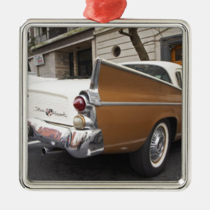 A Studebaker Silver Hawk Classic Car parked on a Metal Tree Decoration