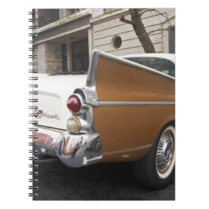A Studebaker Silver Hawk Classic Car parked on a Spiral Notebook