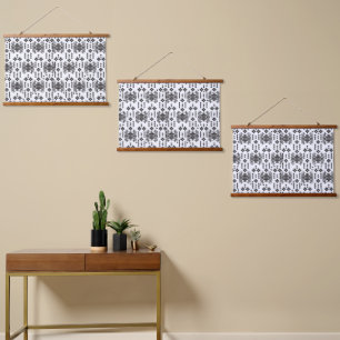 A symmetrical monochrome design featuring intricat hanging tapestry