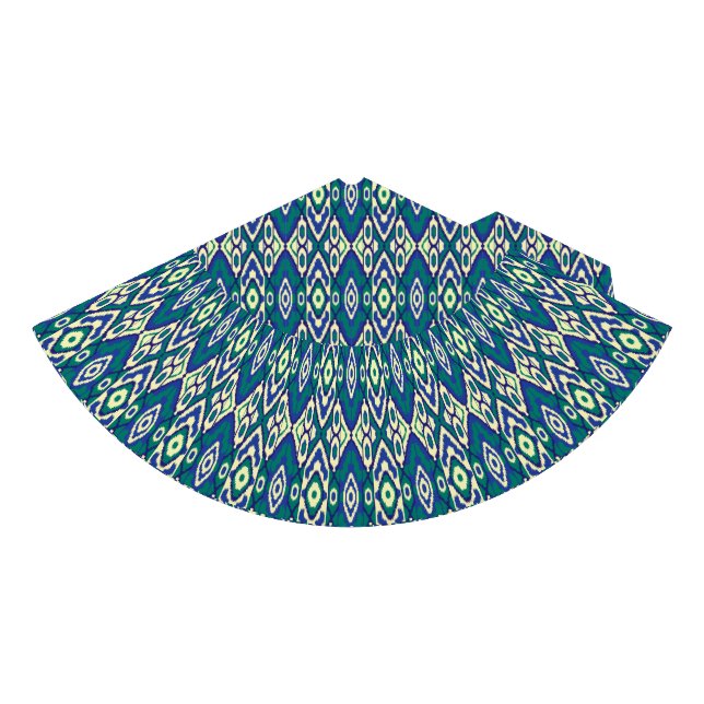A symmetrical pattern of blue motifs on a textile  party hat (Front)