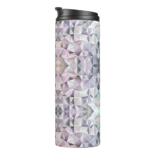 A tall travel mug with a black lid