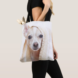 A Tan And White Chihuahua Sits Under A Towel Tote Bag