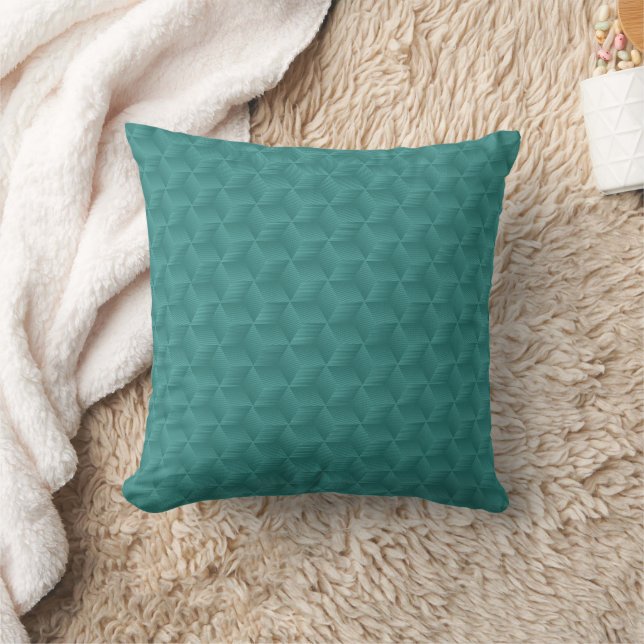 A teal, geometric-patterned throw pillow  (Blanket)