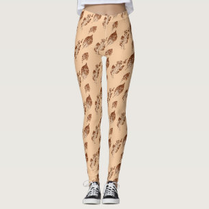 A tiled image of a birch leaves in brow on buff leggings