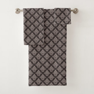 A towel set with an ornate dark brown and white
