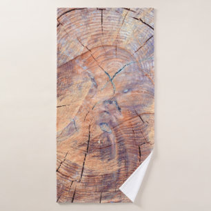 A tree in a cut. Logs lumber in the woods. Texture Bath Towel