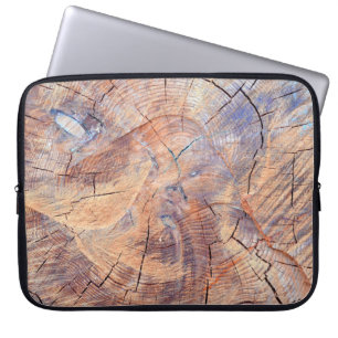 A tree in a cut. Logs lumber in the woods. Texture Laptop Sleeve