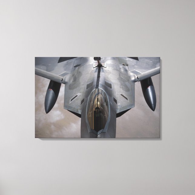 A US Air Force F-22 Raptor is refueled Canvas Print (Front)
