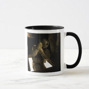 A US Air Force pararescueman begins his descent Mug