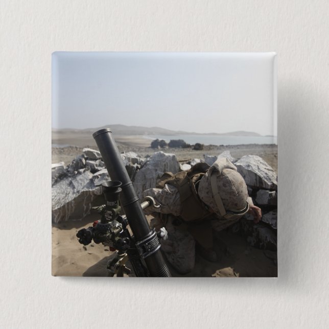 A US Marine fires a mortar in Salinas, Peru 15 Cm Square Badge (Front)
