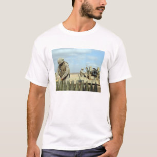 A US Marine prepares howitzer rounds to be fire T-Shirt