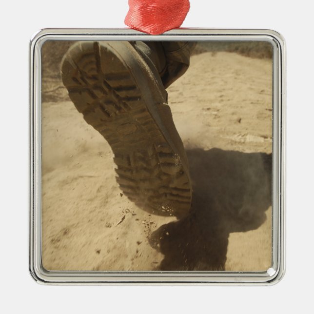 A US soldier walks along a dirt path Metal Tree Decoration (Front)