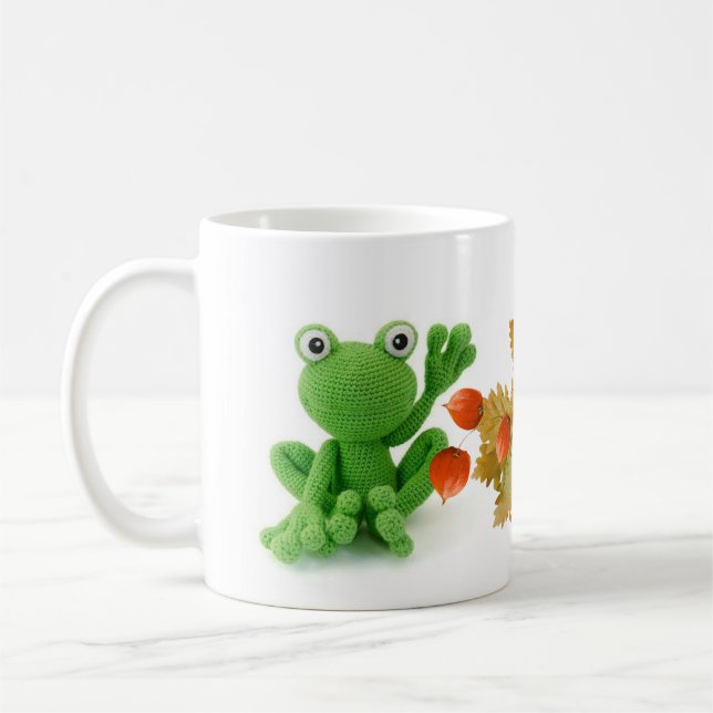 A very green crochet frog coat coffee mug (Left)