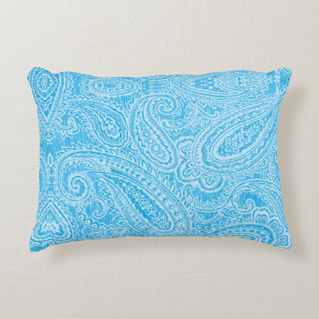 A vibrant blue fabric featuring intricate patterns decorative cushion (Front)