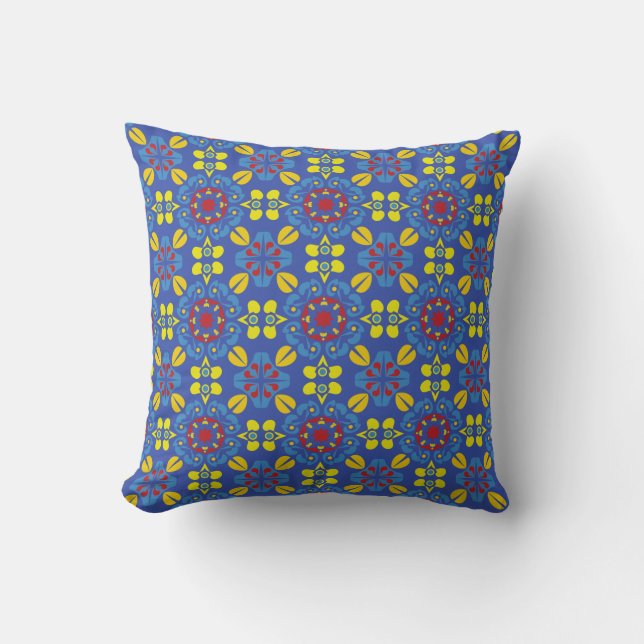 A vibrant geometric pattern with red floral motifs cushion (Front)