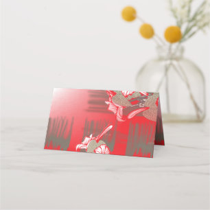 A vibrant graphic design features a red, patterned place card