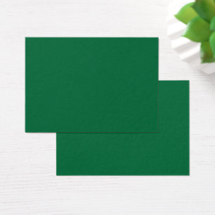 A vibrant green leaf with distinct veins is illumi