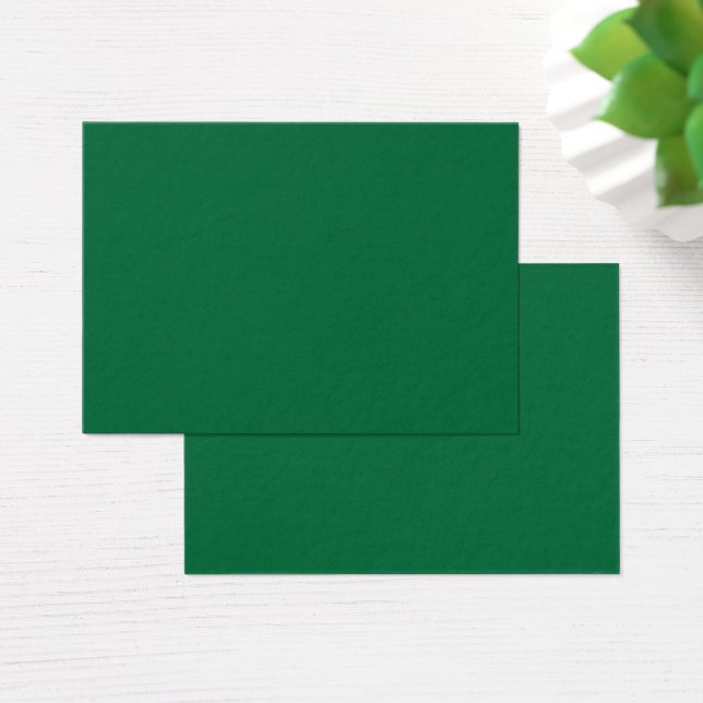 A vibrant green leaf with distinct veins is illumi (Desk)