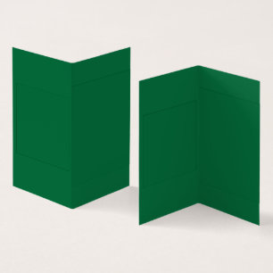 A vibrant green leaf with distinct veins is illumi