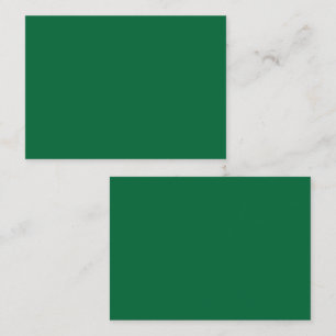 A vibrant green leaf with distinct veins is illumi appointment card