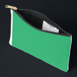 A vibrant green leaf with prominent veins and a de accessory pouch<br><div class="desc">Capture the beauty of nature with this stunning close-up photograph featuring a vibrant green leaf with prominent veins and a glistening dewdrop at its tip. The leaf is set against a softly blurred background,  making it the perfect piece to add a touch of elegance to any room.</div>