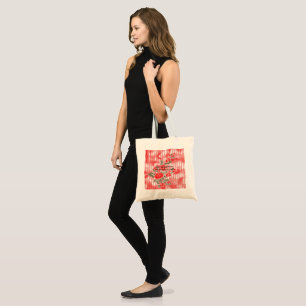 A vibrant red and black scarf displaying a charmin tote bag