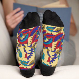 A vibrant textile art piece featuring bold red, ye socks
